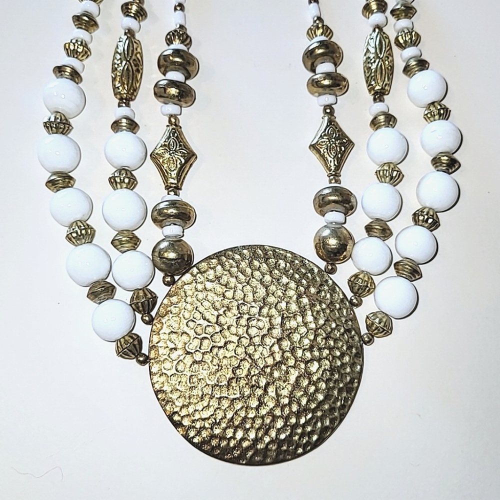 BRASS & WHITE HAMMERED MEDALLION STATEMENT NECKLACE by BAJALIA